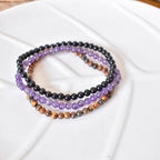 Trío de Pulseras para Protección y Equilibrio | Amatista, Ojo de Tigre y Ónix